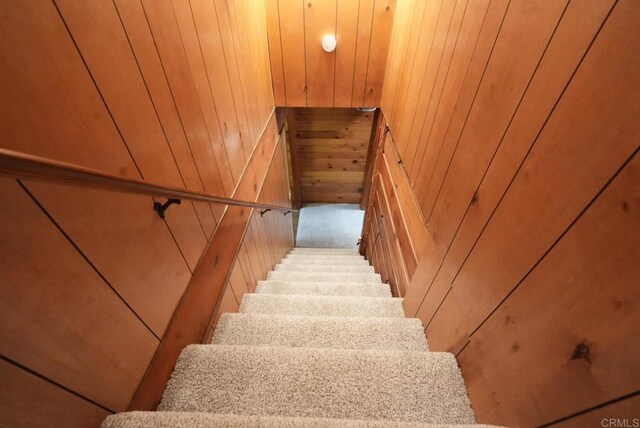 206 Cedar Ln, Sugarloaf, CA 92386 - stairs featuring wood walls and carpet
