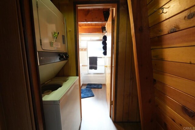 206 Cedar Ln, Sugarloaf, CA 92386 - hall featuring wood walls and stacked washer / drying machine