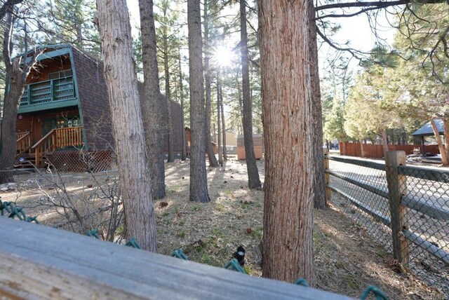 206 Cedar Ln, Sugarloaf, CA 92386 - view of yard with fence and a balcony