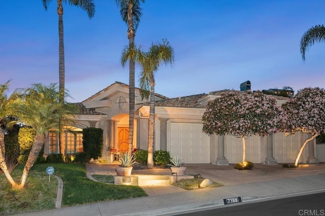 7189 Aviara Dr, Carlsbad, CA 92011 - view of front of property featuring a garage, concrete driveway, and stucco siding