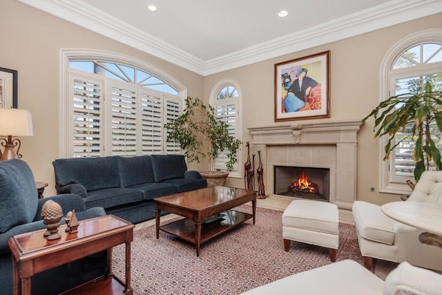 7189 Aviara Dr, Carlsbad, CA 92011 - living area with ornamental molding, recessed lighting, a tiled fireplace, and wood finished floors