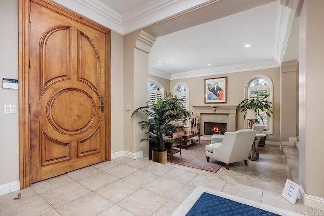 7189 Aviara Dr, Carlsbad, CA 92011 - entrance foyer featuring a fireplace, ornamental molding, baseboards, recessed lighting, and light tile patterned floors