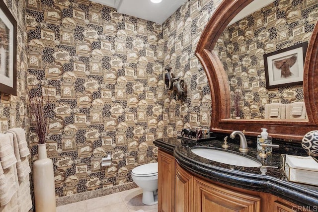 7189 Aviara Dr, Carlsbad, CA 92011 - half bathroom featuring toilet, vanity, and tile patterned flooring