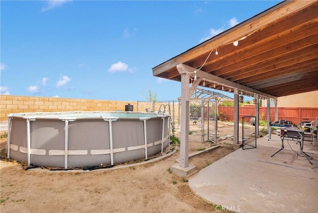 9153 Ravenswood Ave, Hesperia, CA 92344 - view of patio / terrace with a fenced in pool and a fenced backyard