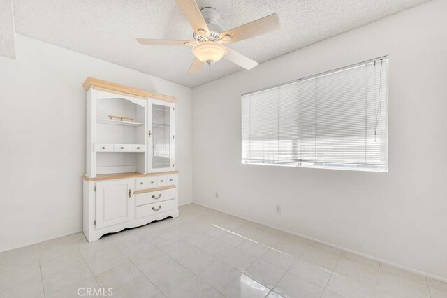 10480 Sunland Blvd Unit 16, Sunland, CA 91040 - spare room with ceiling fan and a textured ceiling