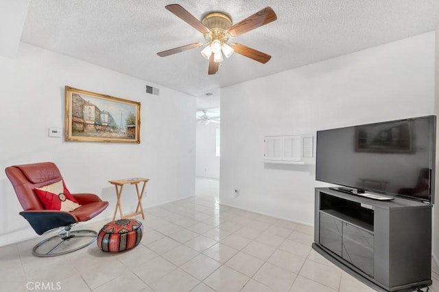 10480 Sunland Blvd Unit 16, Sunland, CA 91040 - sitting room with a textured ceiling, light tile patterned flooring, ceiling fan, baseboards, and visible vents
