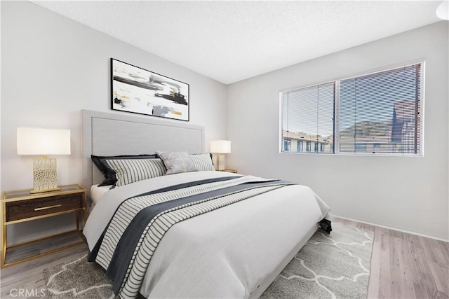 10480 Sunland Blvd Unit 16, Sunland, CA 91040 - bedroom with baseboards and wood finished floors