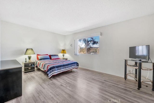 10480 Sunland Blvd Unit 16, Sunland, CA 91040 - bedroom with baseboards and wood finished floors