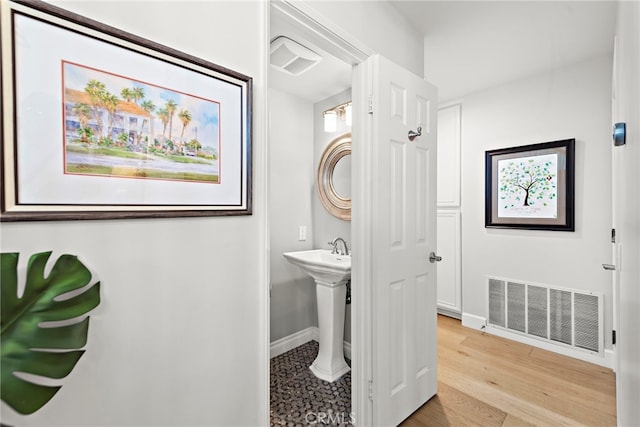 361 Cress St, Laguna Beach, CA 92651 - bathroom featuring baseboards, wood finished floors, and a sink