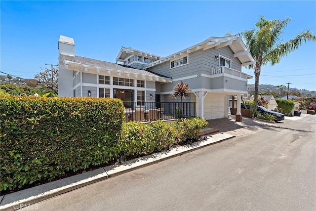 361 Cress St, Laguna Beach, CA 92651 - view of front of home featuring an attached garage and a chimney