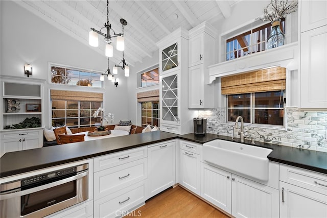 361 Cress St, Laguna Beach, CA 92651 - kitchen with a sink, dark countertops, high vaulted ceiling, backsplash, and wood ceiling