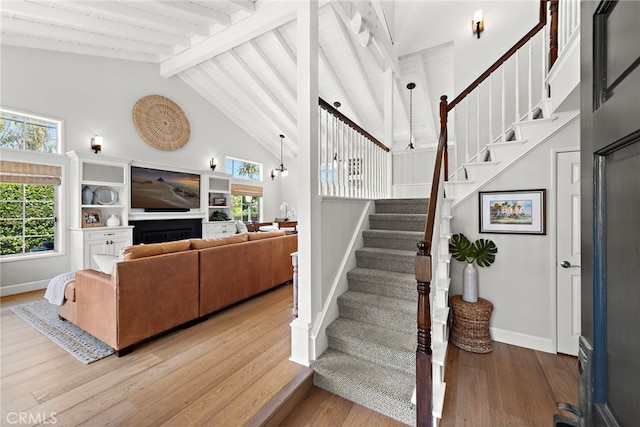 361 Cress St, Laguna Beach, CA 92651 - stairway with beamed ceiling, baseboards, wood finished floors, and high vaulted ceiling