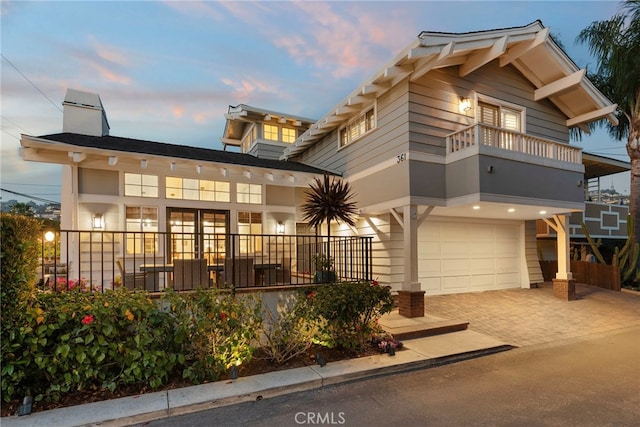 361 Cress St, Laguna Beach, CA 92651 - view of front of house with a garage, a balcony, driveway, and a chimney