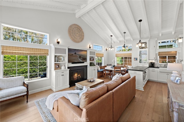 361 Cress St, Laguna Beach, CA 92651 - living room featuring light wood-style floors, a lit fireplace, high vaulted ceiling, beam ceiling, and wooden ceiling