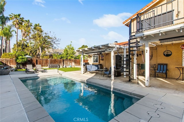 view of pool featuring a fenced backyard, a fenced in pool, and a patio