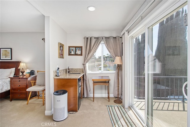 bedroom featuring access to outside, baseboards, and light carpet