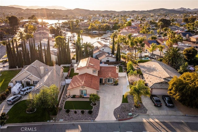 birds eye view of property featuring a mountain view and a residential view