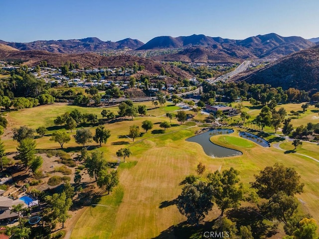 drone / aerial view with a water and mountain view