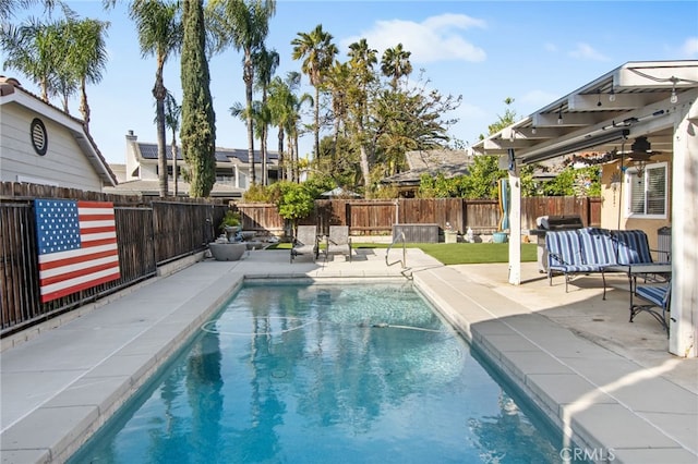 view of swimming pool with a fenced backyard, a fenced in pool, and a patio