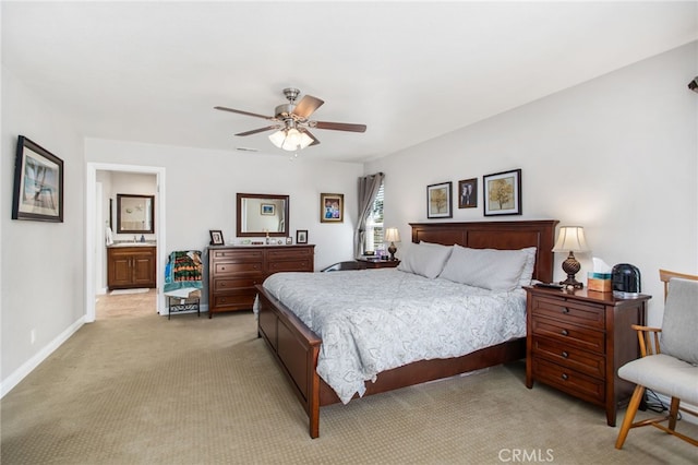 bedroom featuring a sink, ceiling fan, light colored carpet, baseboards, and visible vents