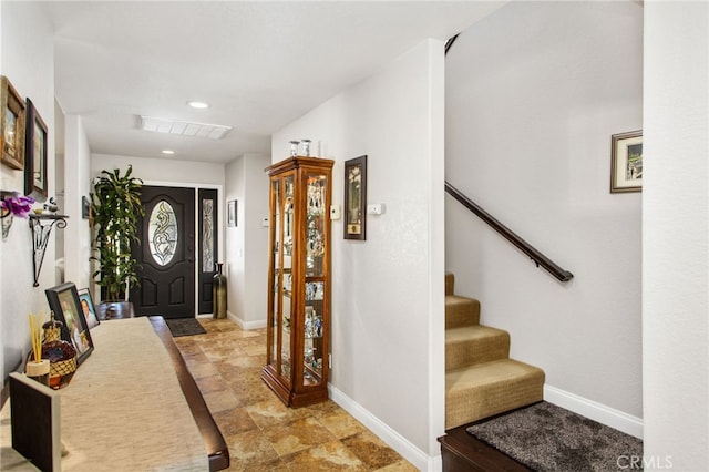 entrance foyer with baseboards, visible vents, recessed lighting, and stairs