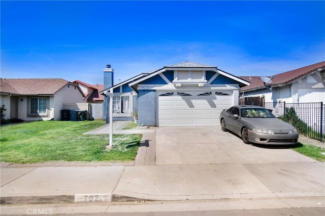 view of front facade featuring concrete driveway, stucco siding, a front yard, a garage, and fence