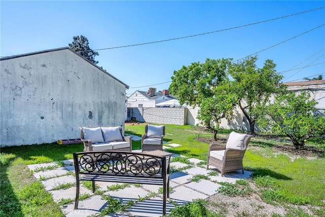 view of patio / terrace with fence and an outdoor hangout area