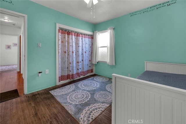 bedroom with a ceiling fan and wood finished floors