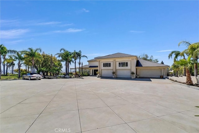 10817 Carriage Dr, Rancho Cucamonga, CA 91737 - view of front of house featuring a garage, stucco siding, and concrete driveway