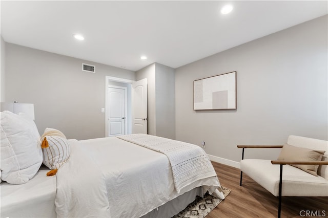 bedroom featuring recessed lighting, baseboards, visible vents, and wood finished floors
