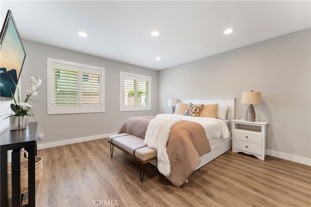 bedroom featuring recessed lighting, baseboards, and light wood finished floors