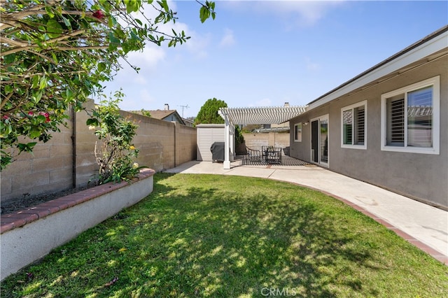 view of yard featuring a storage unit, a pergola, a fenced backyard, a patio area, and an outdoor structure