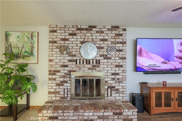 room details with a fireplace and a textured ceiling