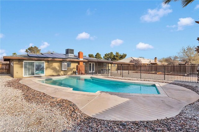 13206 Winona Rd, Apple Valley, CA 92308 - view of swimming pool featuring a fenced in pool, a patio area, central AC, and fence