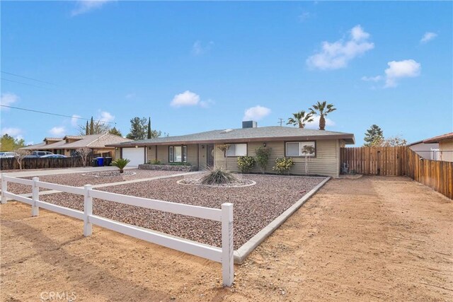 13206 Winona Rd, Apple Valley, CA 92308 - single story home with concrete driveway, fence, and an attached garage