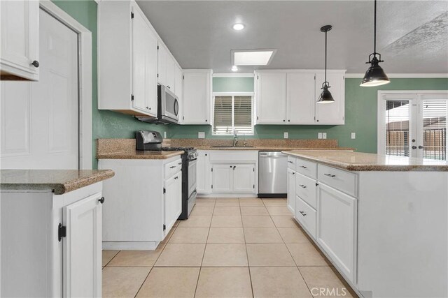 13206 Winona Rd, Apple Valley, CA 92308 - kitchen with light tile patterned floors, a sink, ornamental molding, white cabinetry, and stainless steel appliances
