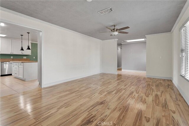 13206 Winona Rd, Apple Valley, CA 92308 - unfurnished living room featuring ornamental molding, visible vents, light wood-style flooring, and a ceiling fan
