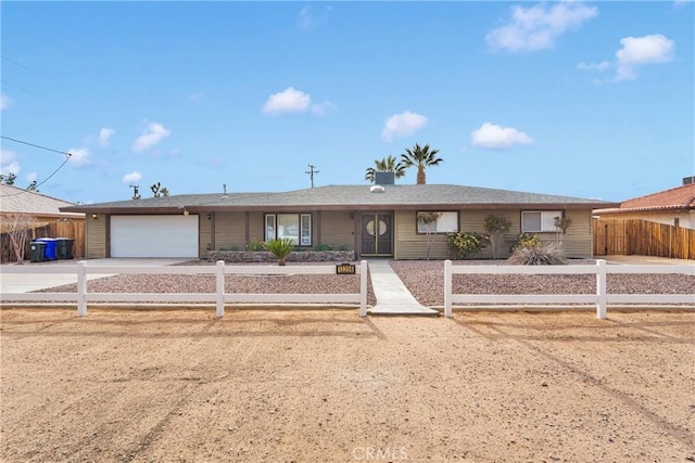 13206 Winona Rd, Apple Valley, CA 92308 - single story home featuring concrete driveway, a garage, and a fenced front yard