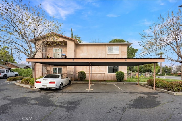 view of front of home with covered parking and stucco siding