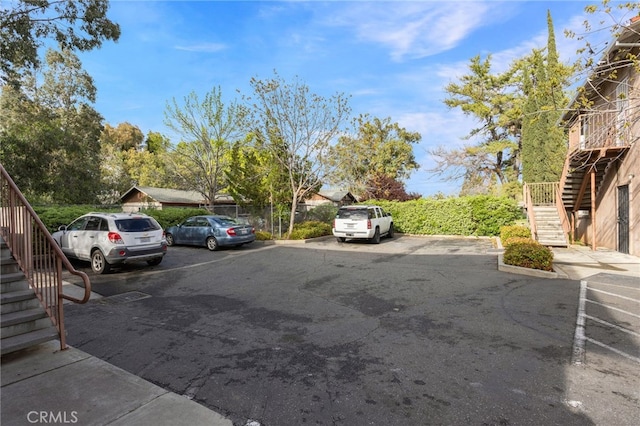 uncovered parking lot featuring stairway