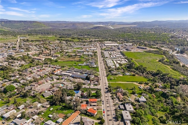 birds eye view of property with a mountain view
