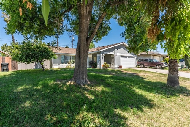 single story home with an attached garage, driveway, and stucco siding
