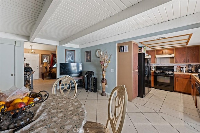 dining room with light tile patterned floors, beamed ceiling, and baseboards