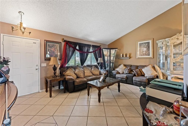 860 3rd St, Rialto, CA 92376 - living room with lofted ceiling, a textured ceiling, light tile patterned floors, and a chandelier