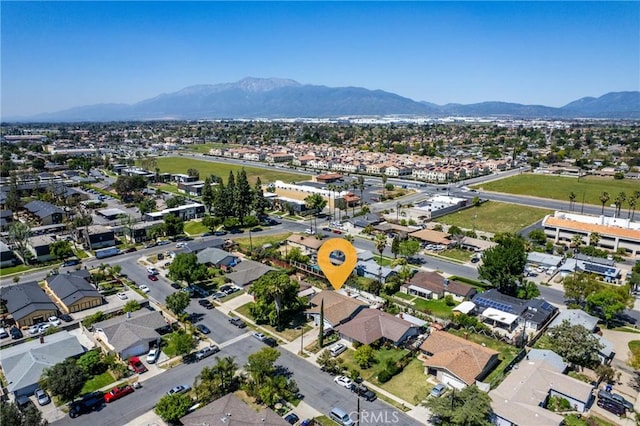 aerial view of residential area featuring mountains