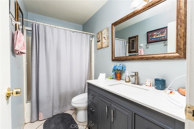 bathroom featuring tile patterned floors, toilet, vanity, and shower / tub combo with curtain