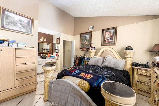 bedroom featuring light tile patterned floors and high vaulted ceiling