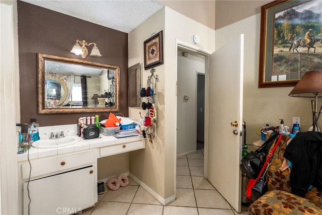 bathroom featuring tile patterned flooring and vanity