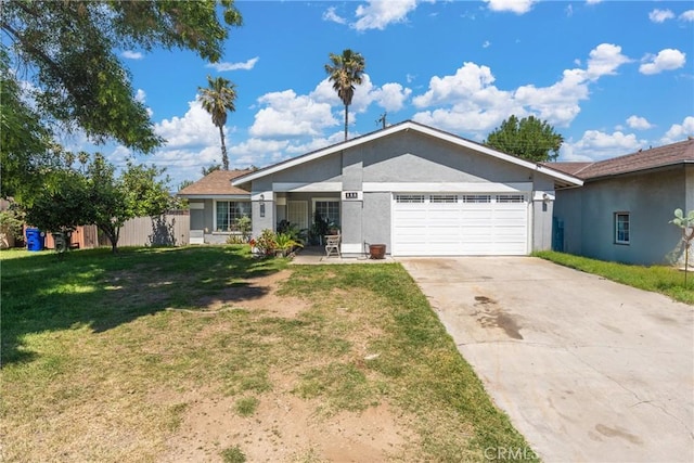 ranch-style house featuring an attached garage, concrete driveway, a front yard, and stucco siding