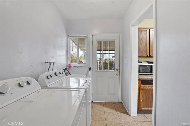 13031305 E Kingsley Ave, Pomona, CA 91767 - washroom with independent washer and dryer, laundry area, light tile patterned floors, and a sink